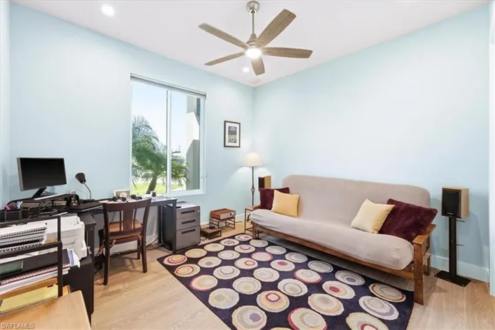 The spacious front bedroom is currently being used as a home office/study
