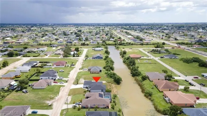 Aerial overview of property's location with nearby suburban area