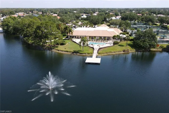 Aerial view of a large body of water and a tree filled landscape