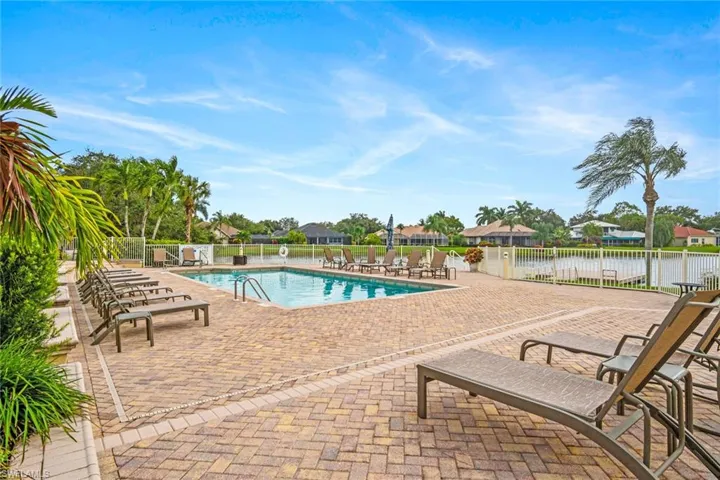 Community pool with a patio area