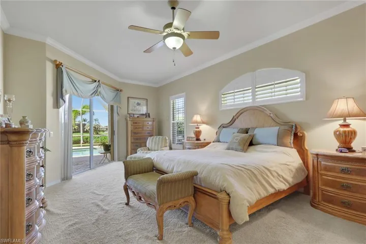 Bedroom with access to outside, carpet floors, crown molding, and a ceiling fan