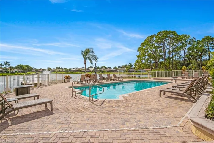 Community pool featuring a patio