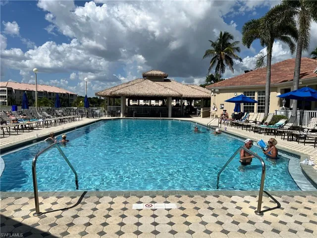 Community pool featuring a Gazebo Tiki Bar with great food