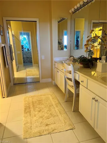 Master Bathroom featuring ceramic tile flooring and double vanity