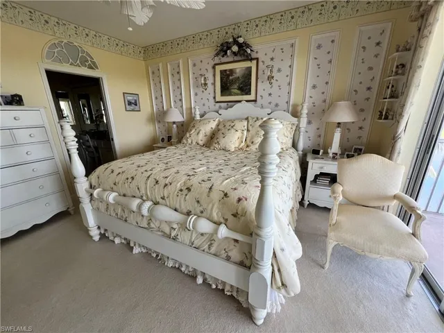 Bedroom with light carpet floor