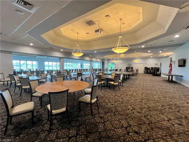 Club House Restaurant Carpeted and featuring a raised ceiling