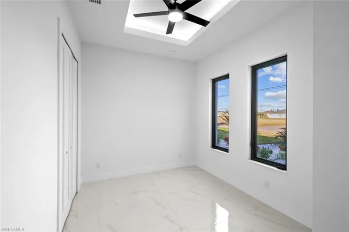 Spare room with ceiling fan