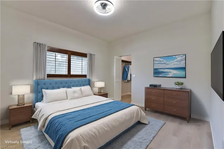 Bedroom with baseboards and light wood-style floors