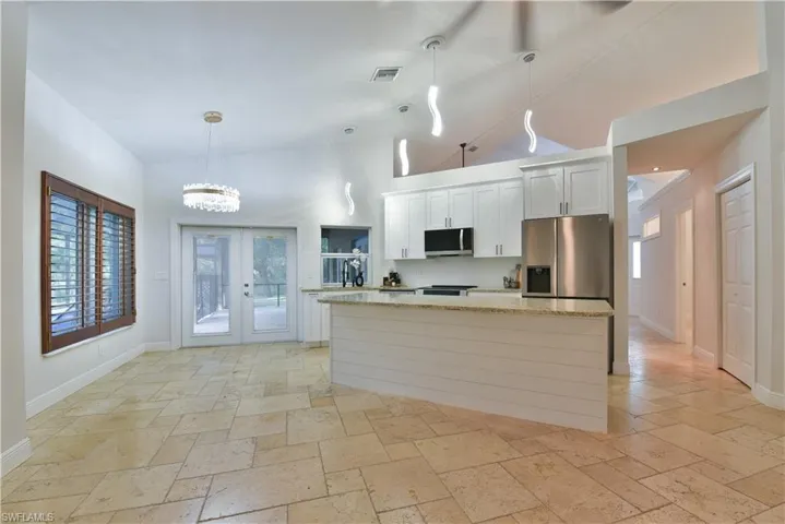 Kitchen featuring visible vents, a wealth of natural light, appliances with stainless steel finishes, and a kitchen island