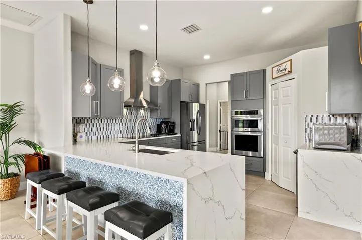 Quartz countertops with waterfall edge.
