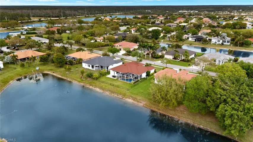 Aerial view with a water view and a residential view