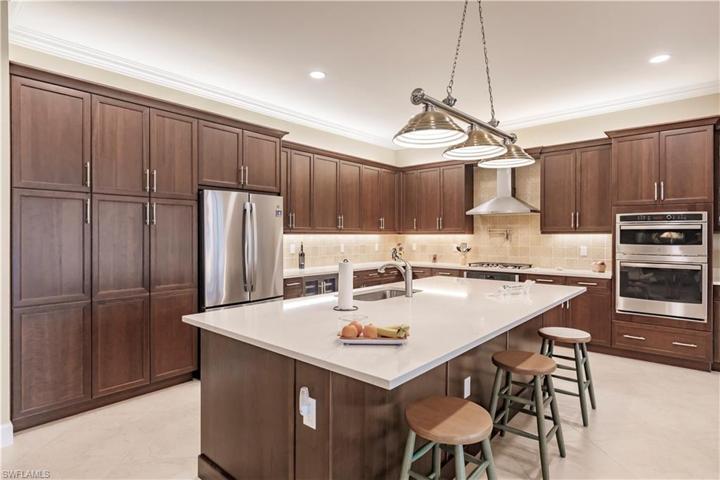 Take your coffee in the morning on the oversized island or welcome guests to sit a spell while you button up your menu.  This chef's delight has tons of storage and ample room to maneuver...