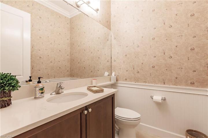 This beauty has 5 bathrooms.  The powder room pictured here is for your guests.  The four (4) other full baths are for your guests "in residence".  It has been stylishly upgraded with a wainscot accoutrement that accentuates and expands the space.