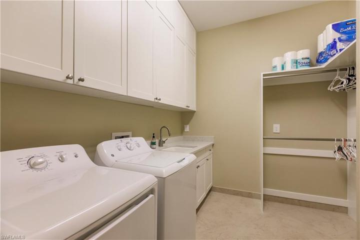 The utility/laundry has loads of storage, hanging space, and a convenient utility sink.  I told you they thought of everything!