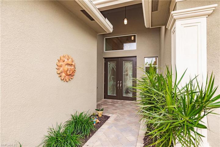 The French double door entry has been tricked up with SW FL themed etched glass that brings light into the wide foyer and through to the rest of the home.  Be sure to check out the natural gas fed whole house generator (a $20-25k upgrade) that will provide you that added comfort of knowing you will never be without a/c and refrigeration in a storm.  This home has it all!