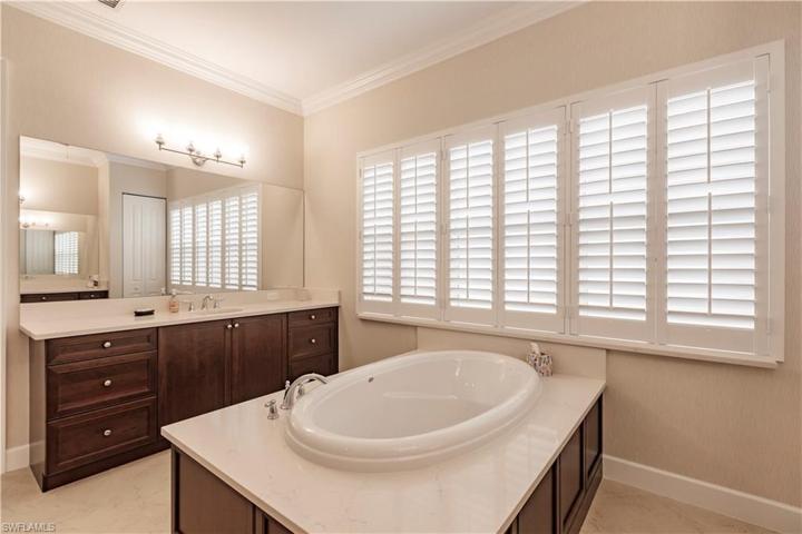Dual undermount sinks make it nice for everyone.  You'll always know where your toothbrush is in this master ensuite!