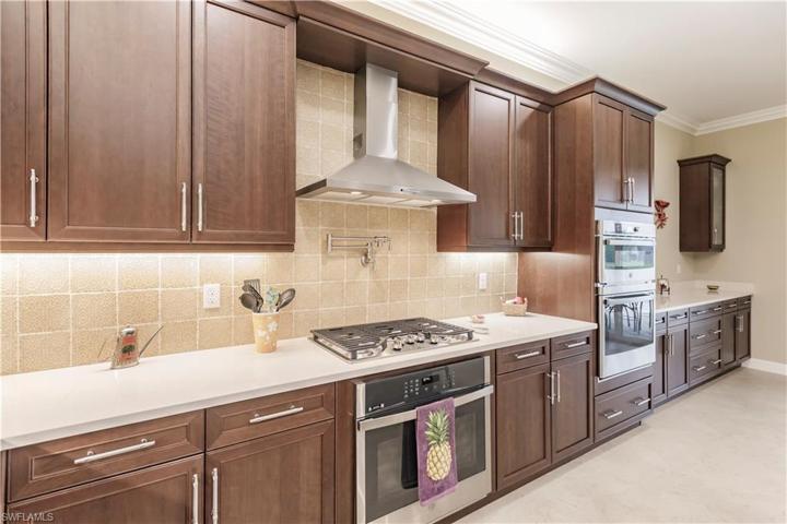 One of the benefits of living in this GL community is the natural gas.  The stove top is fully vented, comes with convenient extendable water, double gas ovens and micro/convection unit.  They thought of everything when they had this home built to suit by the developer.  I think they did GREAT!