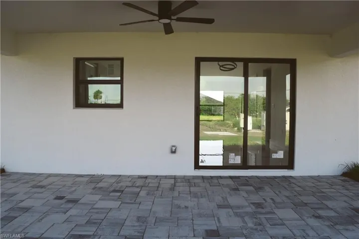 View of patio featuring a ceiling fan