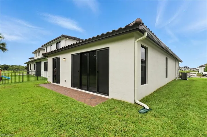 Back of property with stucco siding