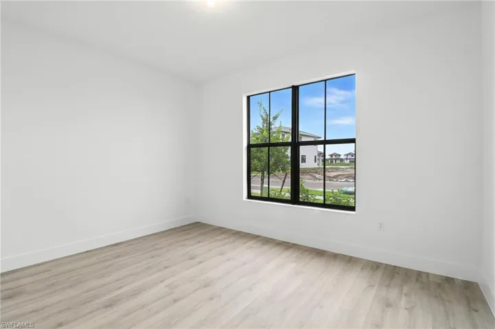 Empty room featuring light wood-style floors and baseboards