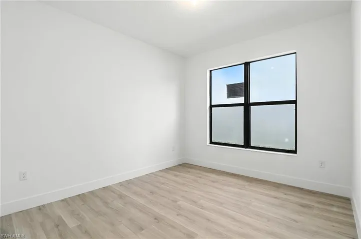 Spare room featuring light wood finished floors