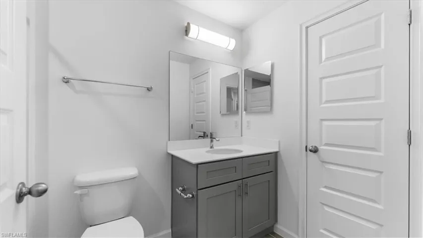 Half bath with vanity and toilet