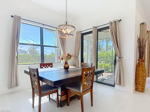 Dining room featuring a chandelier and light tile patterned floors