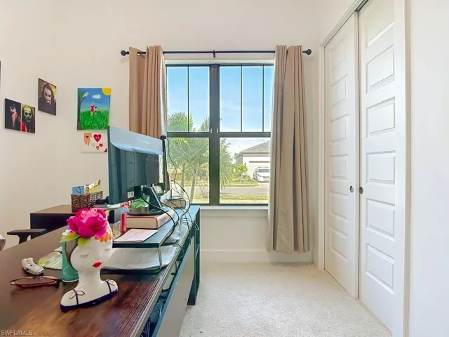 Office space featuring light carpet