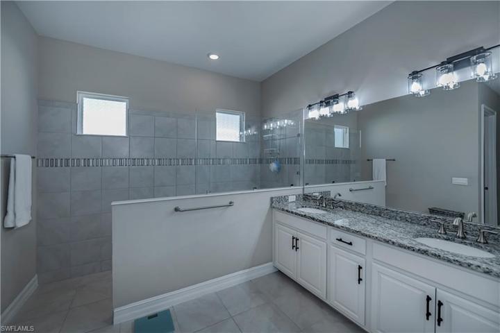 Primary Bathroom Offering Plenty of Storage and Dual Sinks