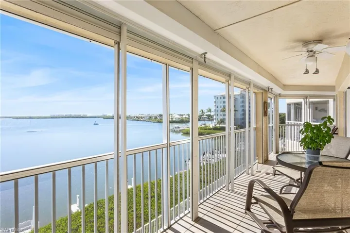 Oh those views...screened and tiled balcony with electric storm shutters!