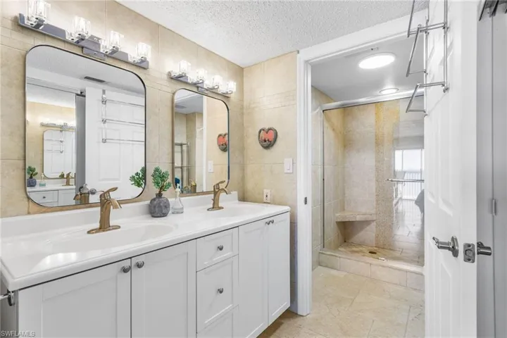 Beautifully renovated with dual sinks, new lighting, vanity, plumbing/lighting fixtures.