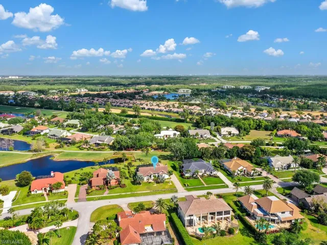 Birds eye view of property featuring a water view and a residential view