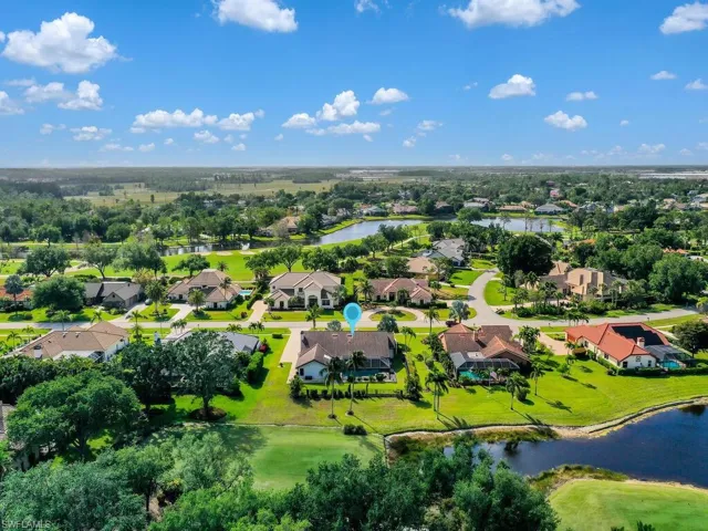 Drone / aerial view with a water view and a residential view