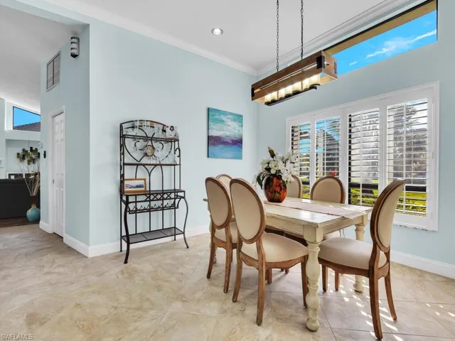 Dining room with recessed lighting, visible vents, baseboards, and ornamental molding