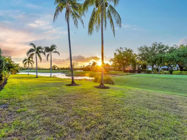 View of community featuring a water view and a yard