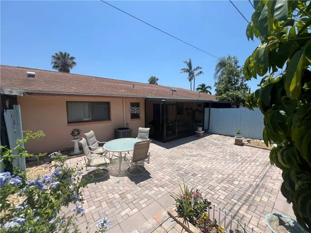 Back of house with a patio