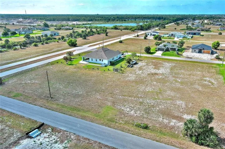 Aerial view of residential area featuring a large body of water