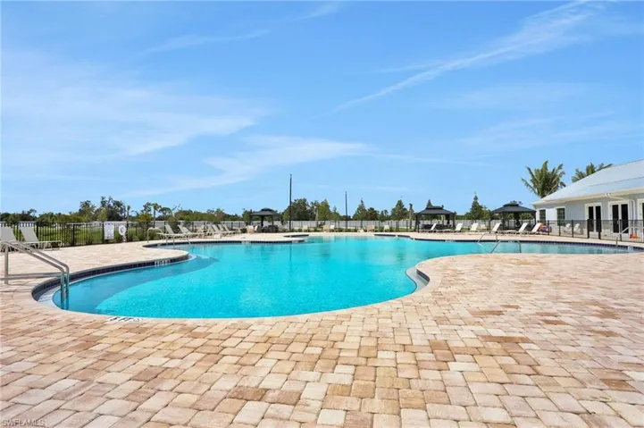 Community pool with a patio area