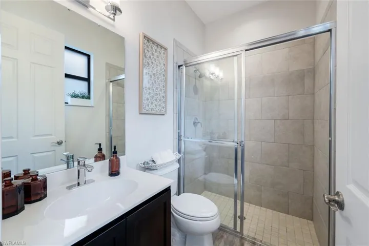 En suite bath to hobby room.