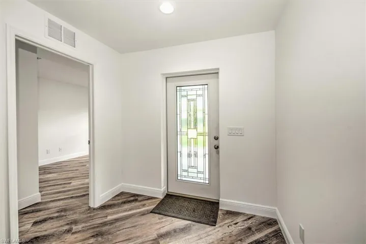 Front entry has impact decorative glass to allow more natural light into the home.