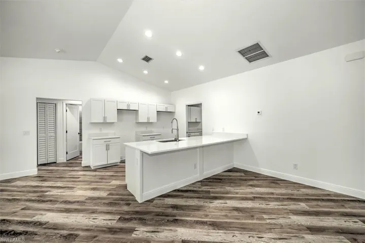View of the kitchen with a large bar top to add additional seating
