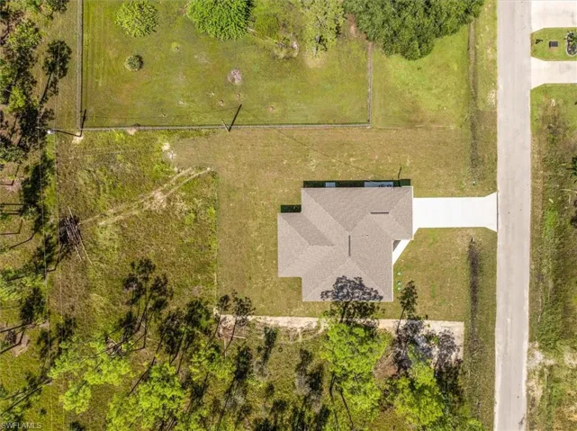 Roof view. Notice this home has a hip roof which means it slopes on all sides. This design is what insurance companies prefer you to have to get an extra discount on your wind.
