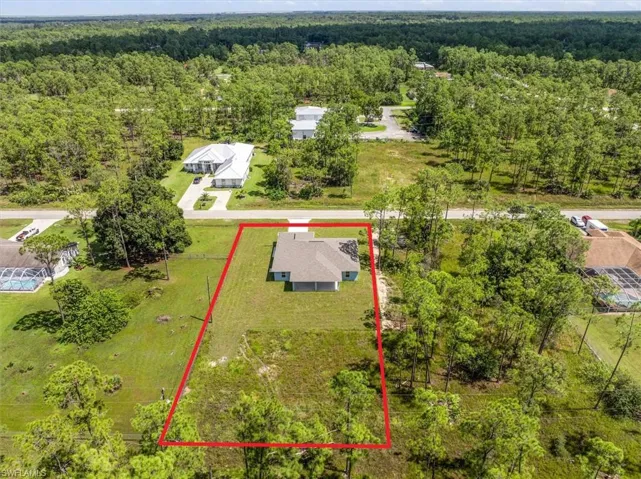 Aerial view. You will notice the home is slightly over from center giving you more room to access from the driveway side to the backyard. Perfect set up for someoen that wants to park a boat or RV in the back yard.