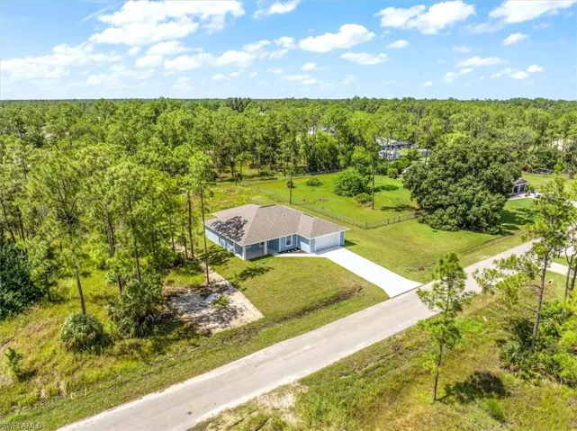 This home is on a half acre and the home to the right is set on an acre so you get additional privacy between homes.