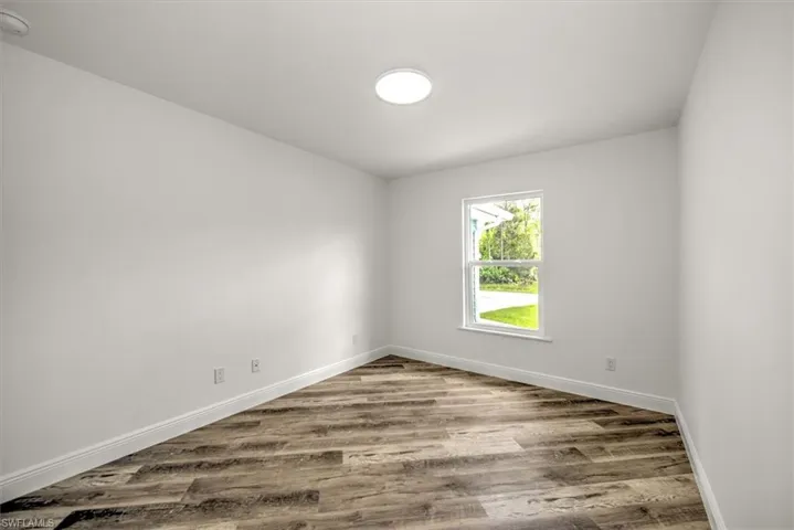 Bedroom 2 with a standard closet. This bedroom is just off the front entry which would make a great office.