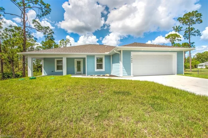 Concrete block home with the front offering a concrete mortar siding finish which looks great!