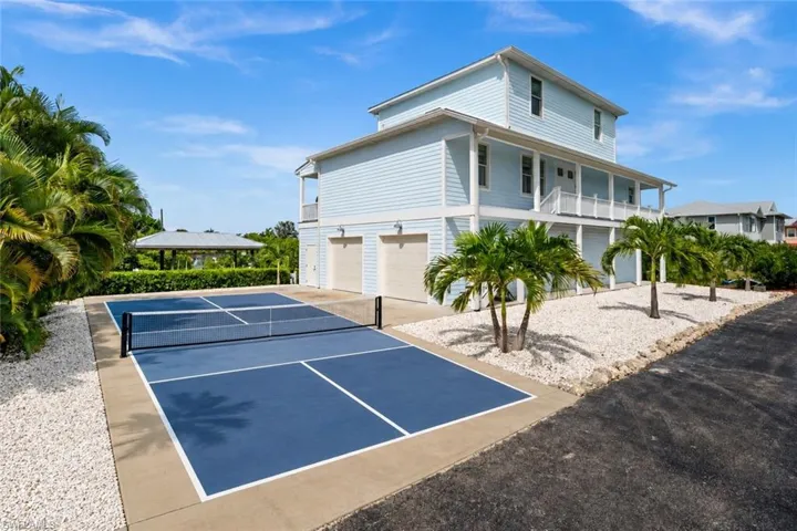 Driveway is large enough to accommodate a pickle ball court.