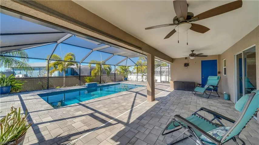 View of pool featuring a patio area,  and a screened enclosure