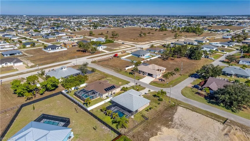 View of property location with nearby suburban area