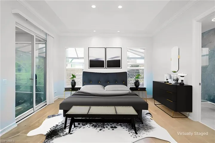 Virtually Staged Primary Bedroom with access to outside, light wood-type flooring, and crown molding